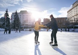 Couple skating at Olympic Plaza in Calgary
